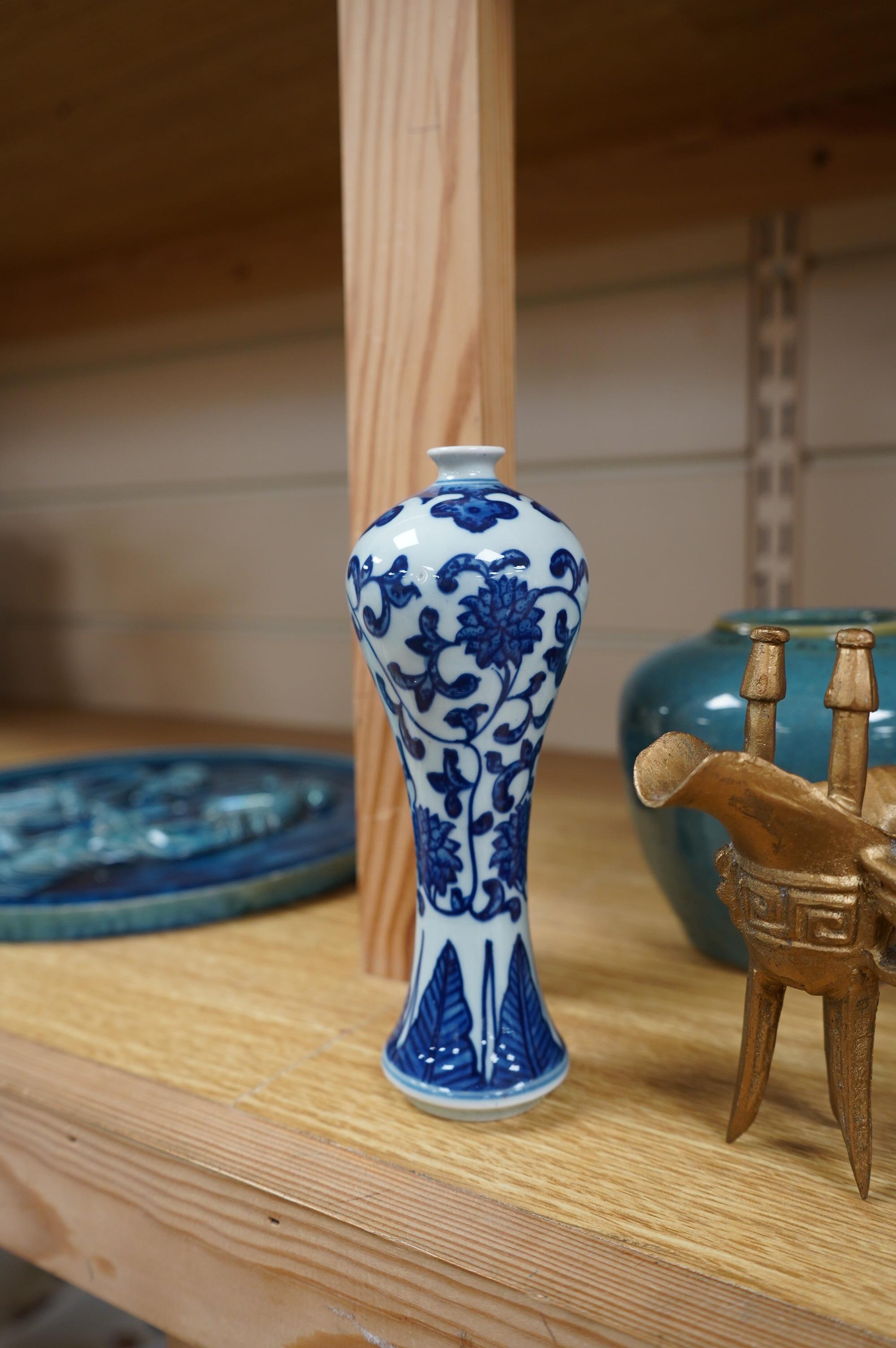 A group of Chinese and Japanese ceramics to include Yixing teapots, porcelain cups and saucers, a blue and white vase and a tiger talisman. Condition - mostly good